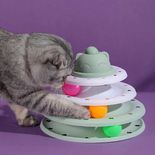 Cat playing with a 4-level cat roller tower featuring colorful balls for interactive fun