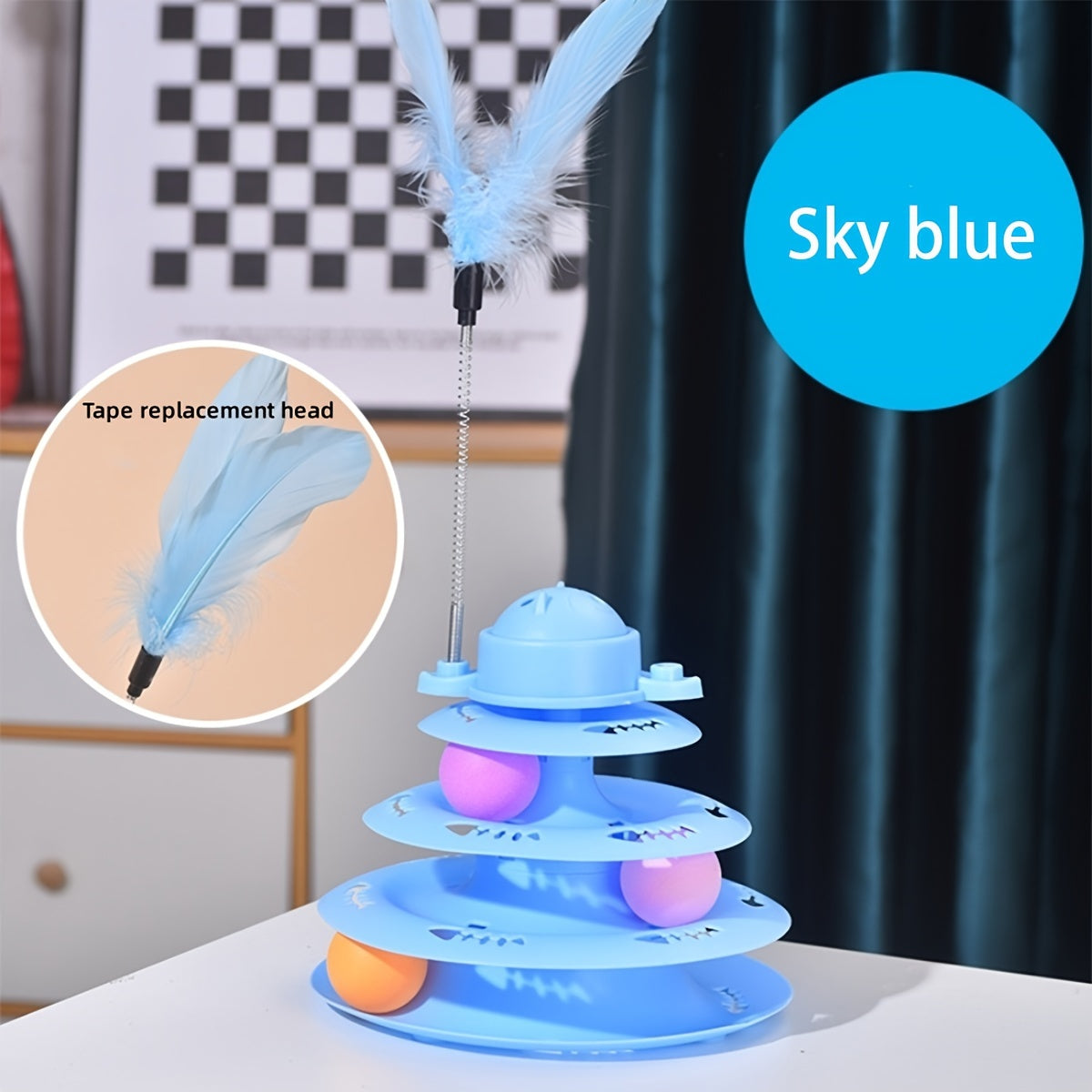 Interactive cat tower toy in sky blue with feather wand and colorful balls for playful cats